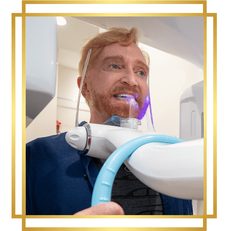 cbct machine being used on dental patient