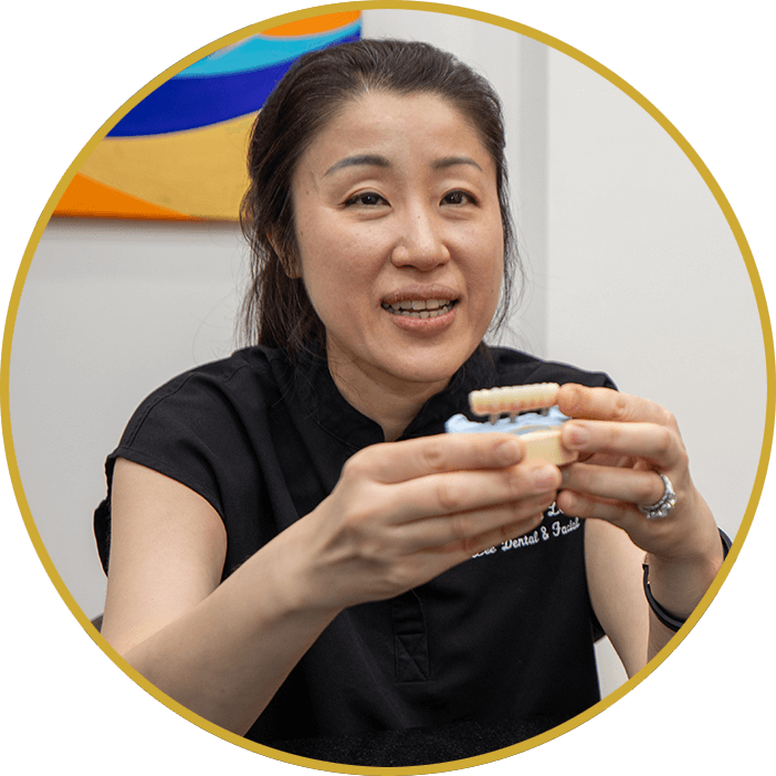 dr lee holding full arch