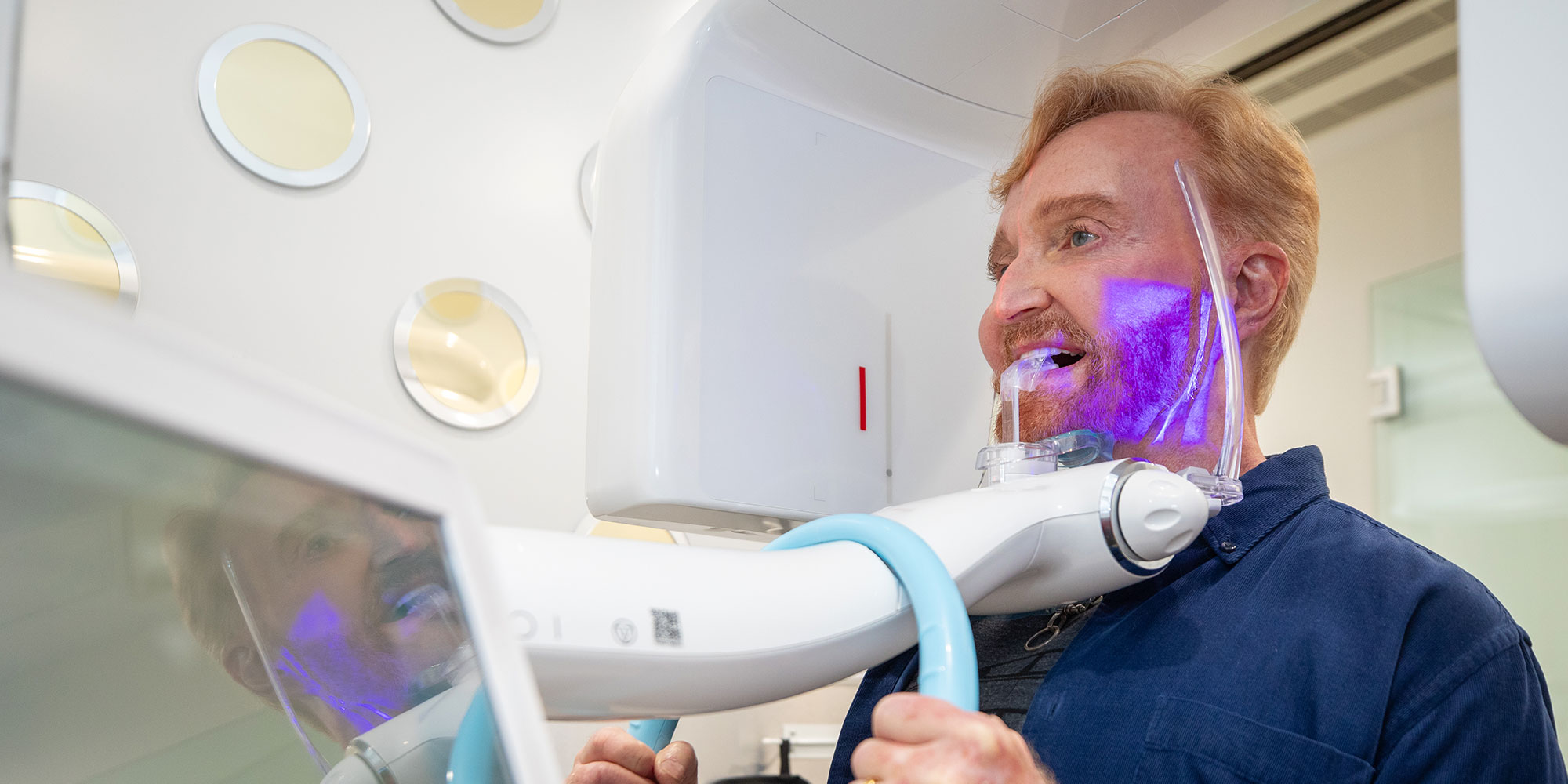 smiling dental patient getting cbct