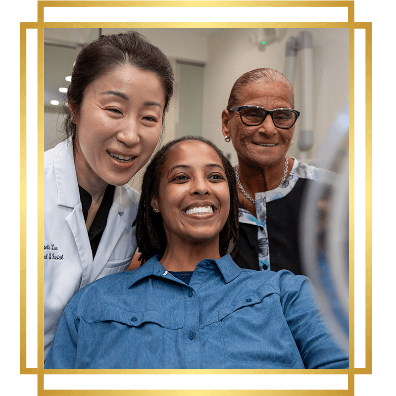 dr with dental patient blue dress shirt