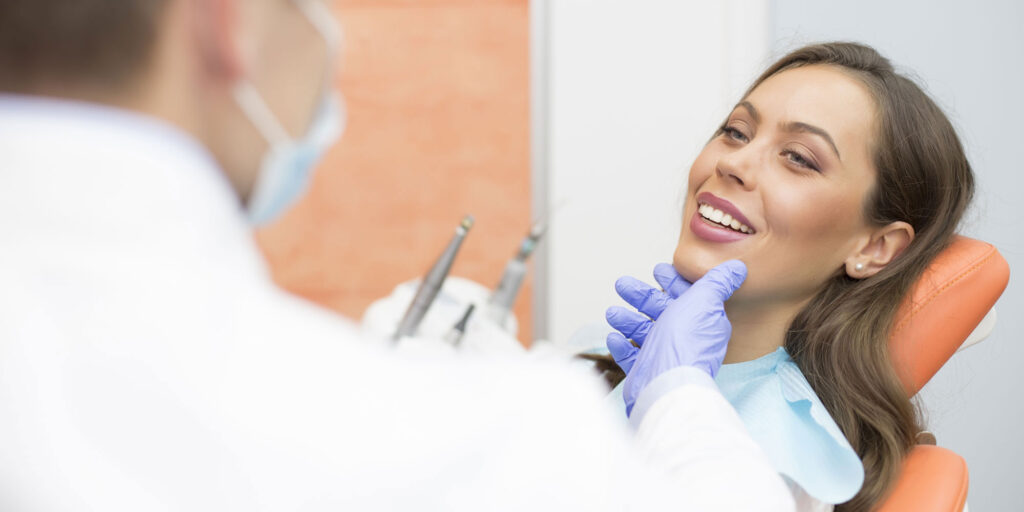 dental patient with doctor looking things over